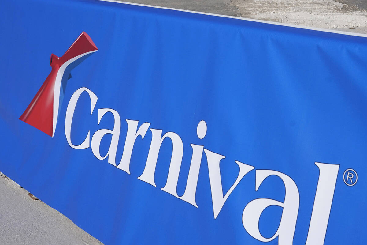 FILE - This Jan. 29, 2021 file photo shows a Carnival Cruise Line sign at PortMiami in Miami. C ...