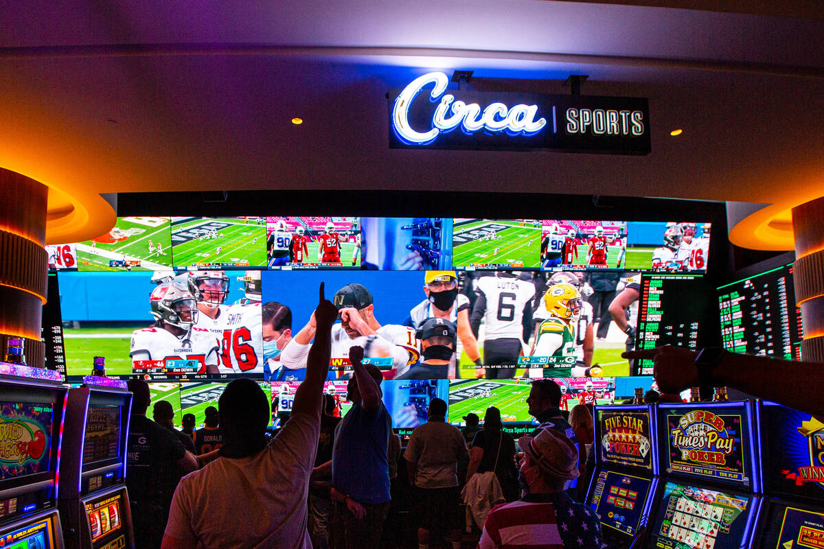 Football fans take in the action at the Circa Sportsbook as NFL games play across the 78-millio ...