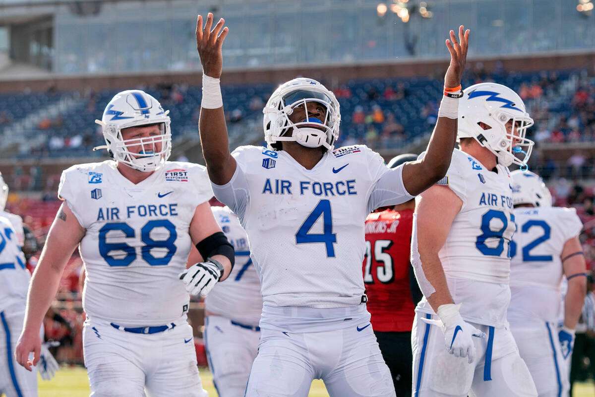 FILE - Air Force quarterback Haaziq Daniels (4) celebrates a touchdown run against Louisville a ...