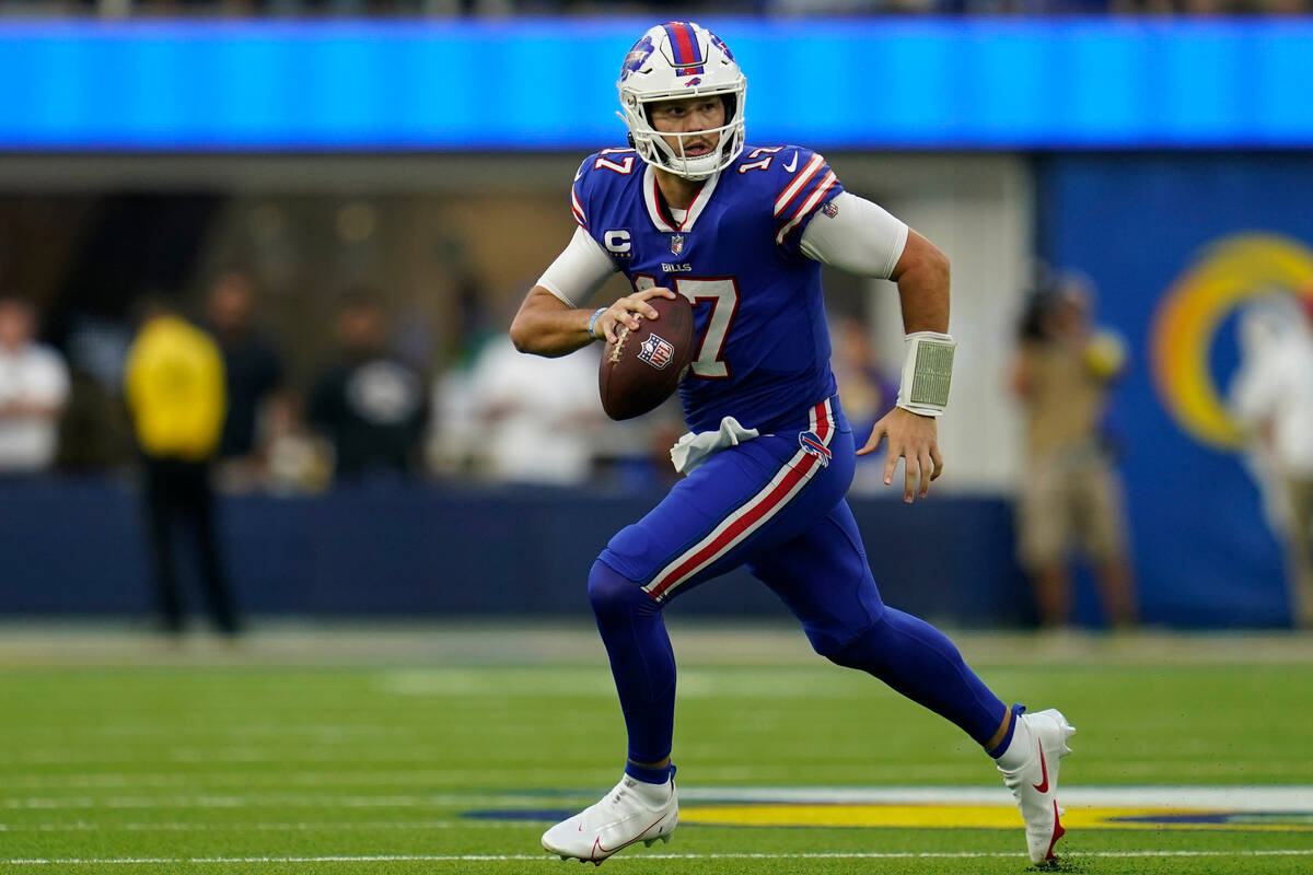Buffalo Bills quarterback Josh Allen (17) runs the ball during an NFL football game against the ...